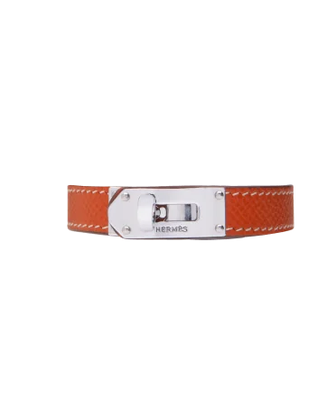 Brazalete de la casa de lujo Hermès en Acero y Cuero naranja. Disponible en VIRTU LUXURY.