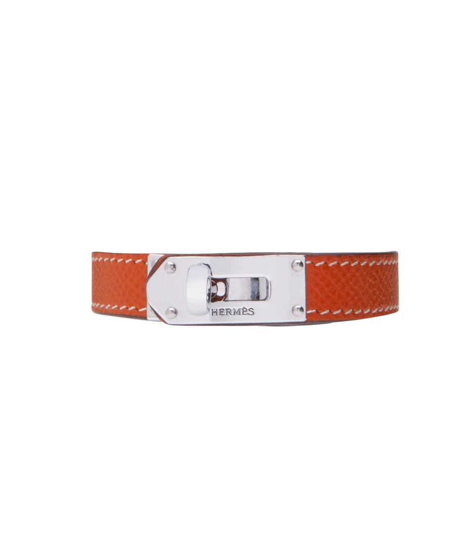 Brazalete de la casa de lujo Hermès en Acero y Cuero naranja. Disponible en VIRTU LUXURY. Brazalete de la casa de lujo Hermès en Acero y Cuero naranja. Disponible en VIRTU LUXURY.